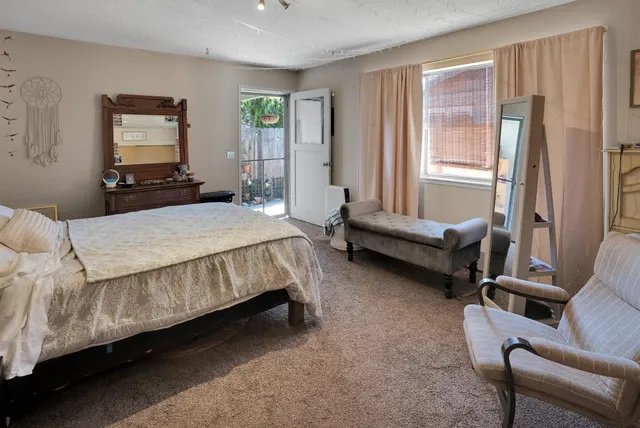 a bedroom with a bed and a couch