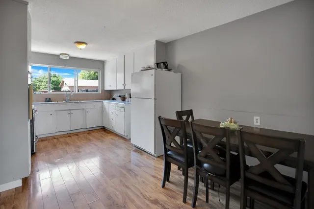 a kitchen with a table and chairs in it