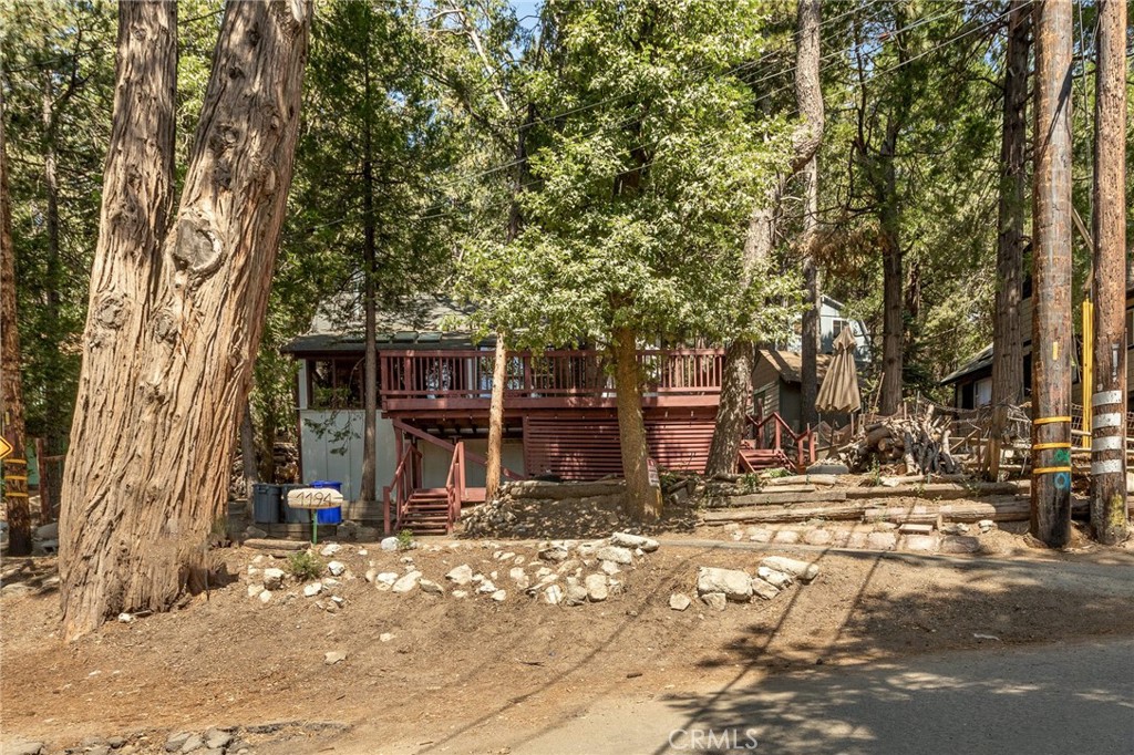 1194 Scenic Way Rimforest, CA 92378 - Photo 1 of 1 a view of a house with a tree in the background
