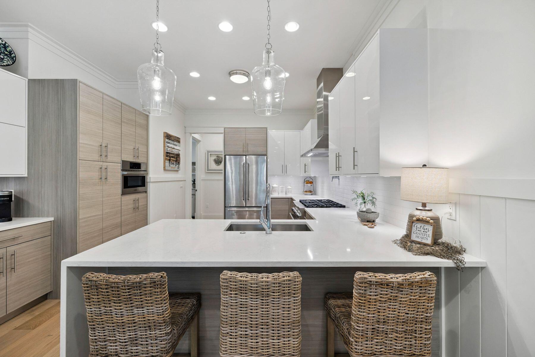 25 Pontchartrain North Santa Rosa Beach, FL 32459 - Photo 11 of 48 a kitchen with kitchen island a sink stainless steel appliances and counter space