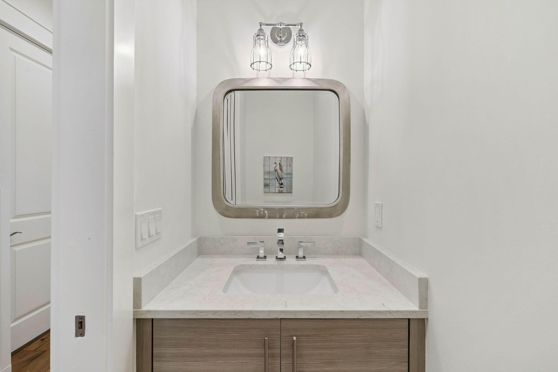 25 Pontchartrain North Santa Rosa Beach, FL 32459 - Photo 15 of 48 a bathroom with a sink and a mirror