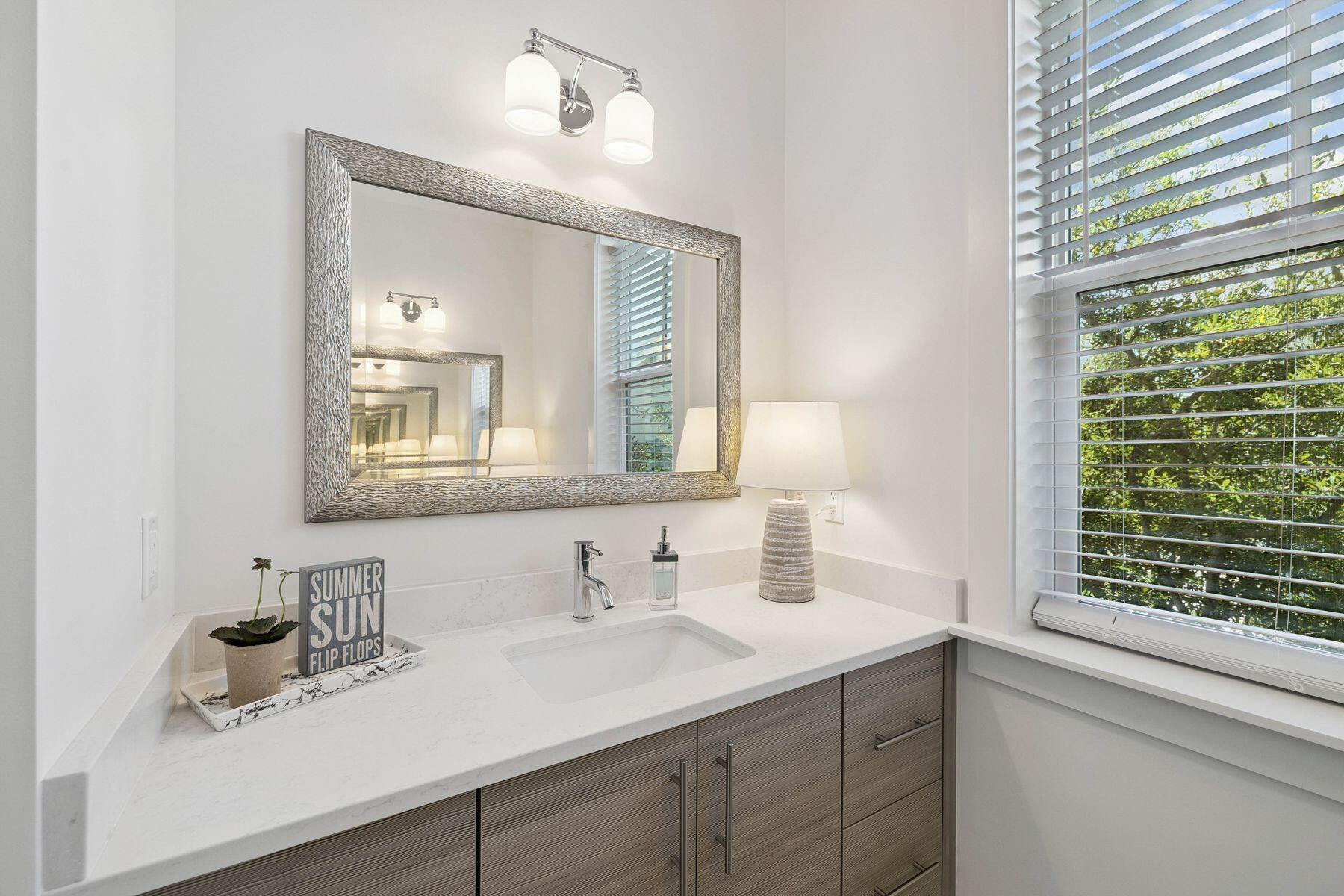 25 Pontchartrain North Santa Rosa Beach, FL 32459 - Photo 31 of 48 a bathroom with a sink and a mirror