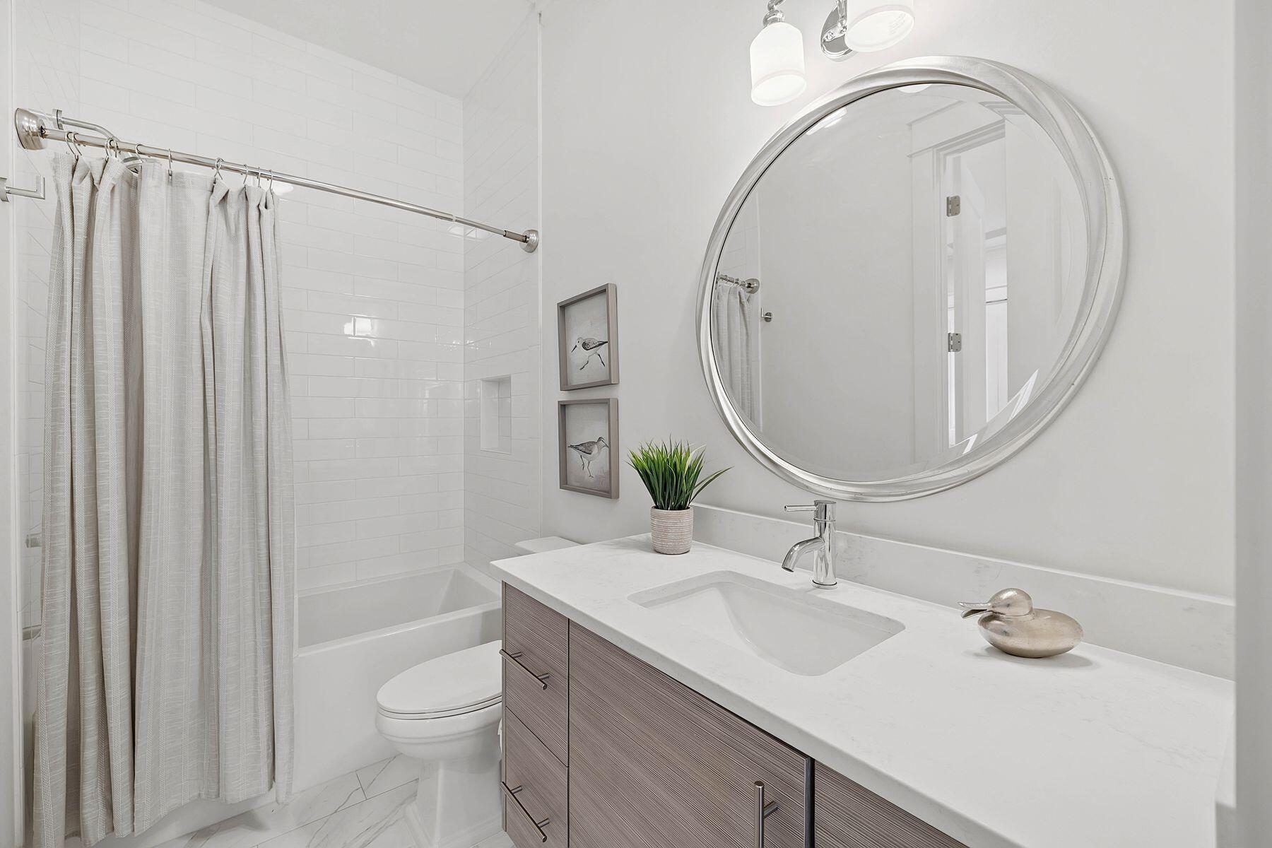 25 Pontchartrain North Santa Rosa Beach, FL 32459 - Photo 36 of 48 a bathroom with a sink a toilet and a mirror
