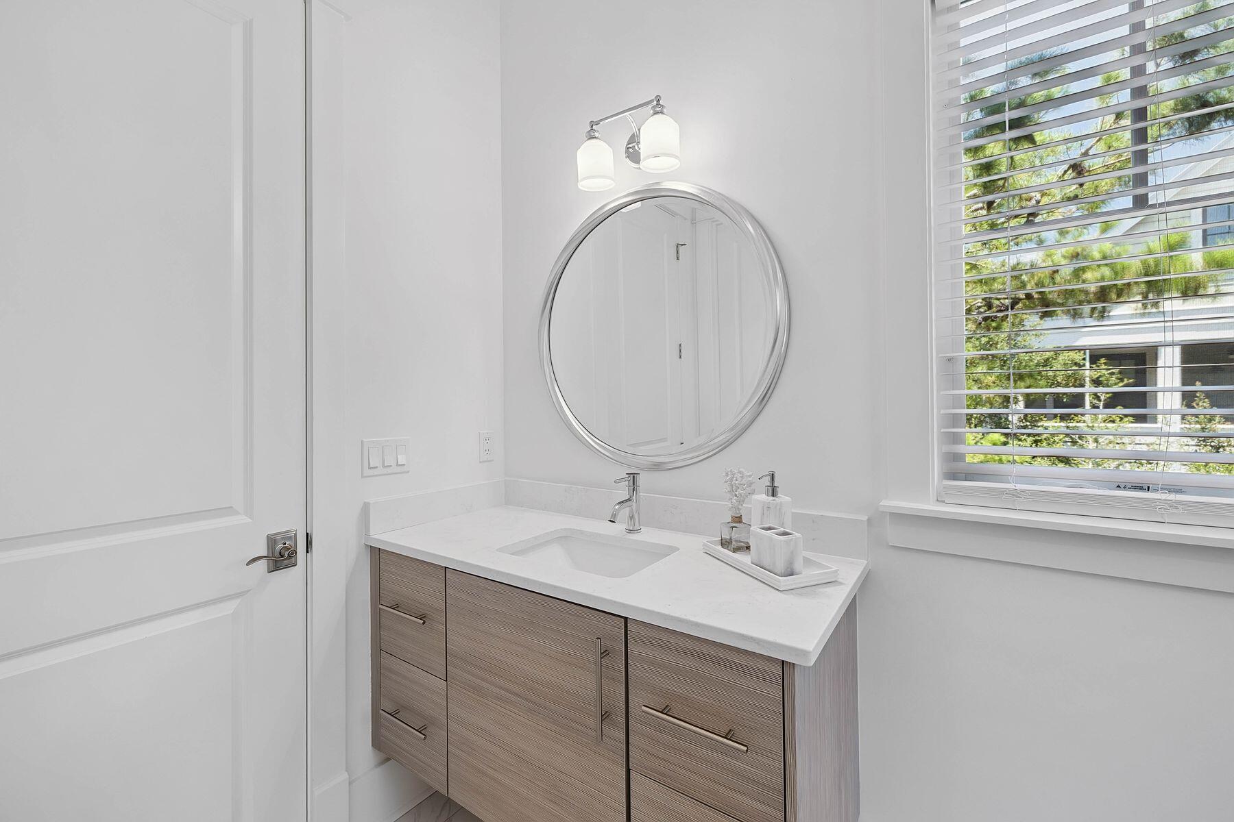 25 Pontchartrain North Santa Rosa Beach, FL 32459 - Photo 39 of 48 a bathroom with a sink and a mirror
