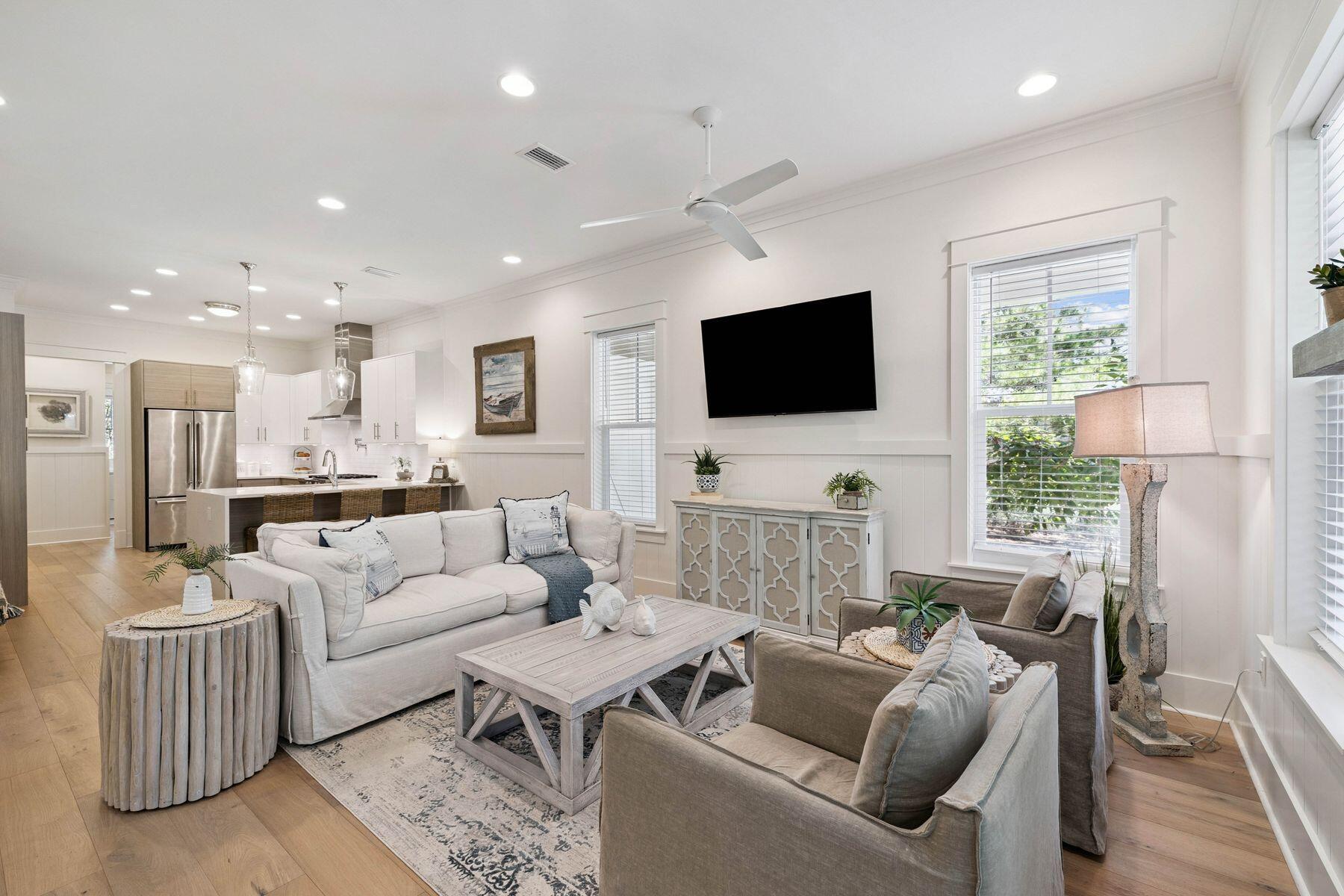 25 Pontchartrain North Santa Rosa Beach, FL 32459 - Photo 5 of 48 a living room with furniture a flat screen tv and a large window