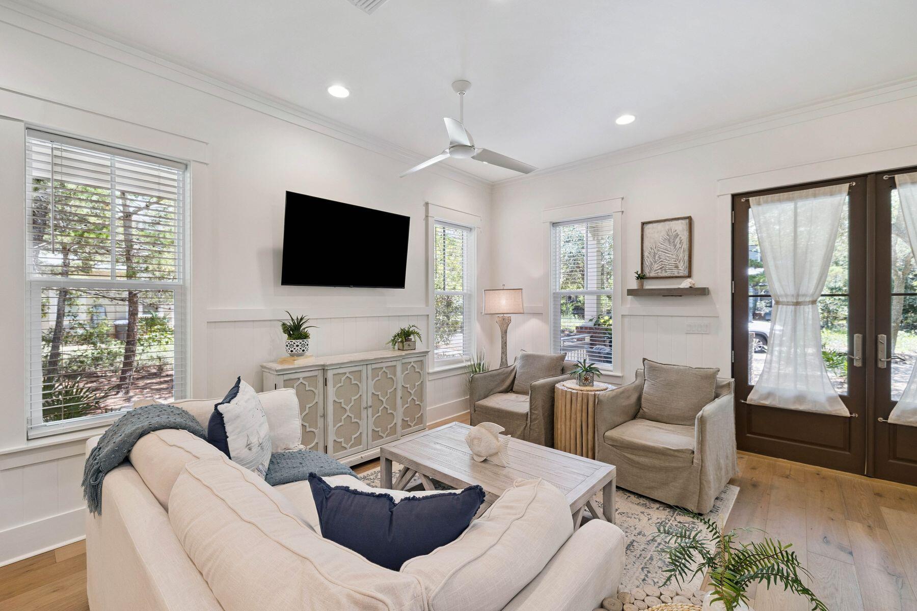 25 Pontchartrain North Santa Rosa Beach, FL 32459 - Photo 6 of 48 a living room with furniture and a flat screen tv