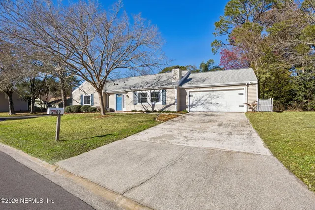 a view of house with yard