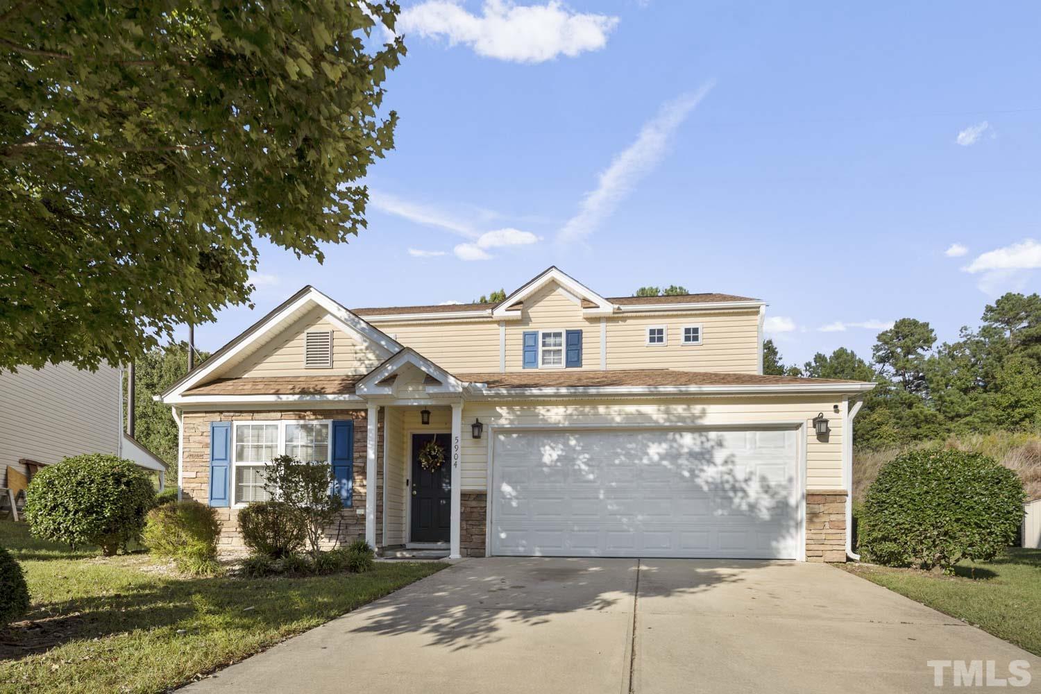 5904 Rivercliff Court Raleigh, NC 27610 - Photo 1 of 30 a front view of a house with garden
