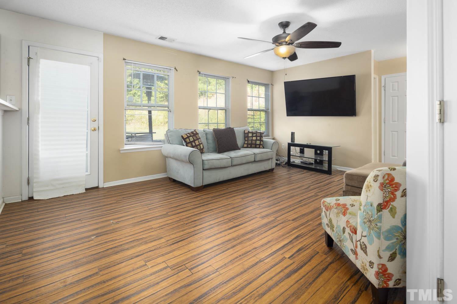 5904 Rivercliff Court Raleigh, NC 27610 - Photo 15 of 30 a living room with furniture fireplace and a flat screen tv