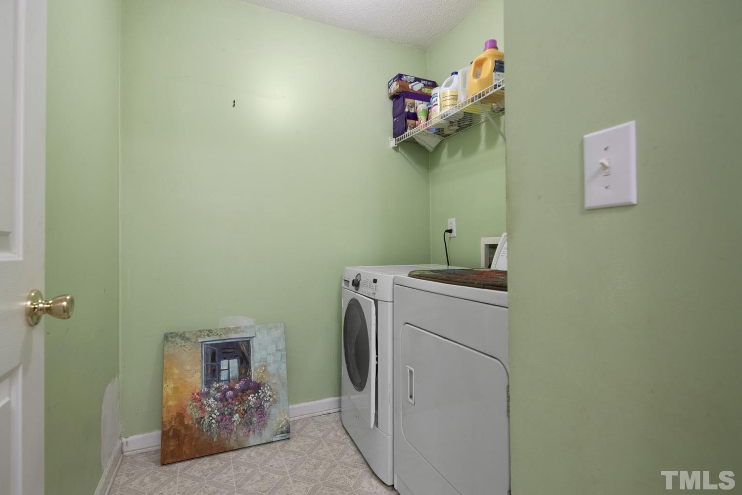 5904 Rivercliff Court Raleigh, NC 27610 - Photo 19 of 30 a utility room with dryer and washer
