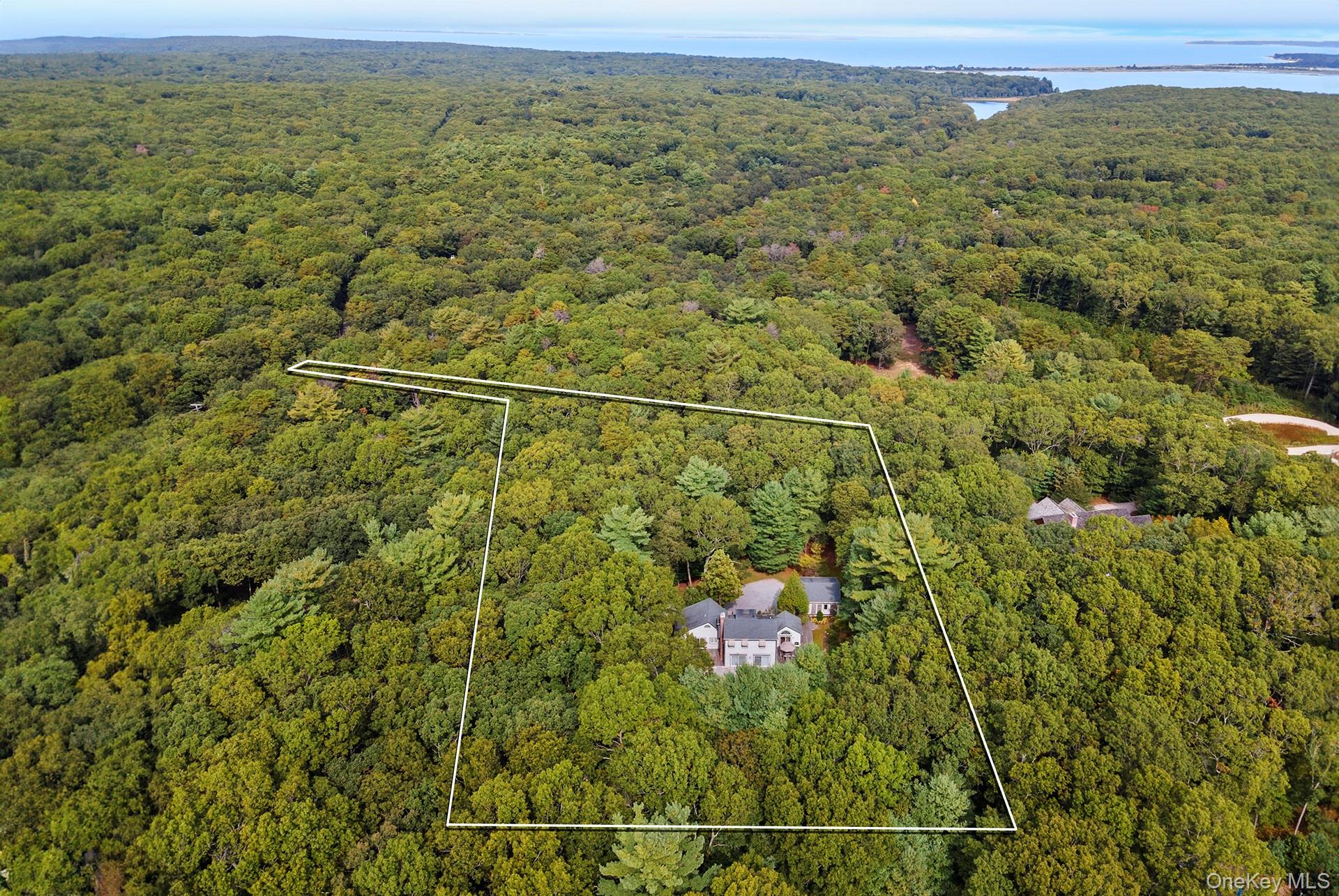 530 Hands Creek Road East Hampton, NY 11937 - Photo 1 of 47 Aerial view of property's location featuring property parcel outlined and a large body of water