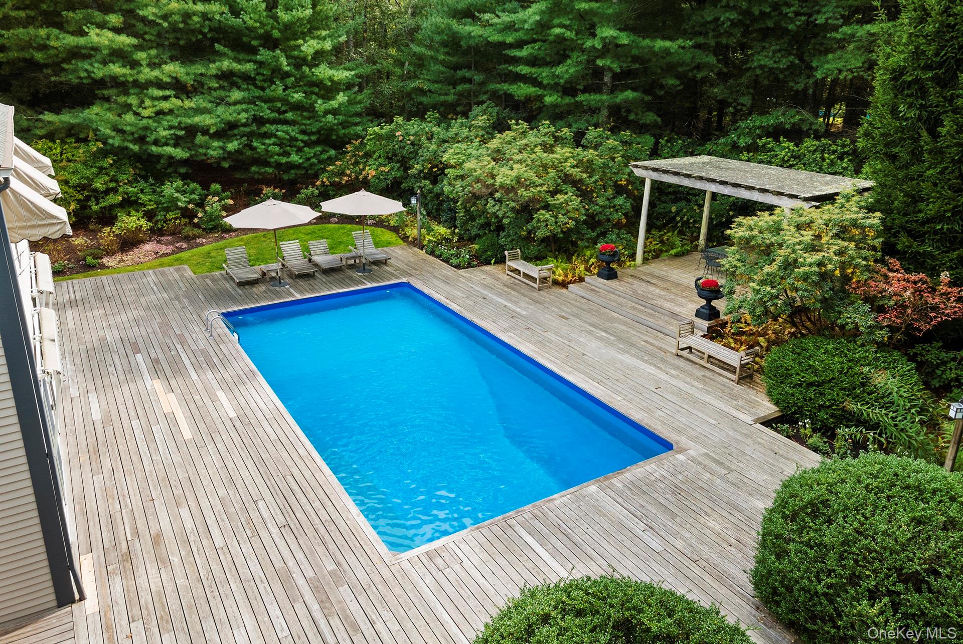 530 Hands Creek Road East Hampton, NY 11937 - Photo 42 of 47 Swimming pool featuring a wooden deck