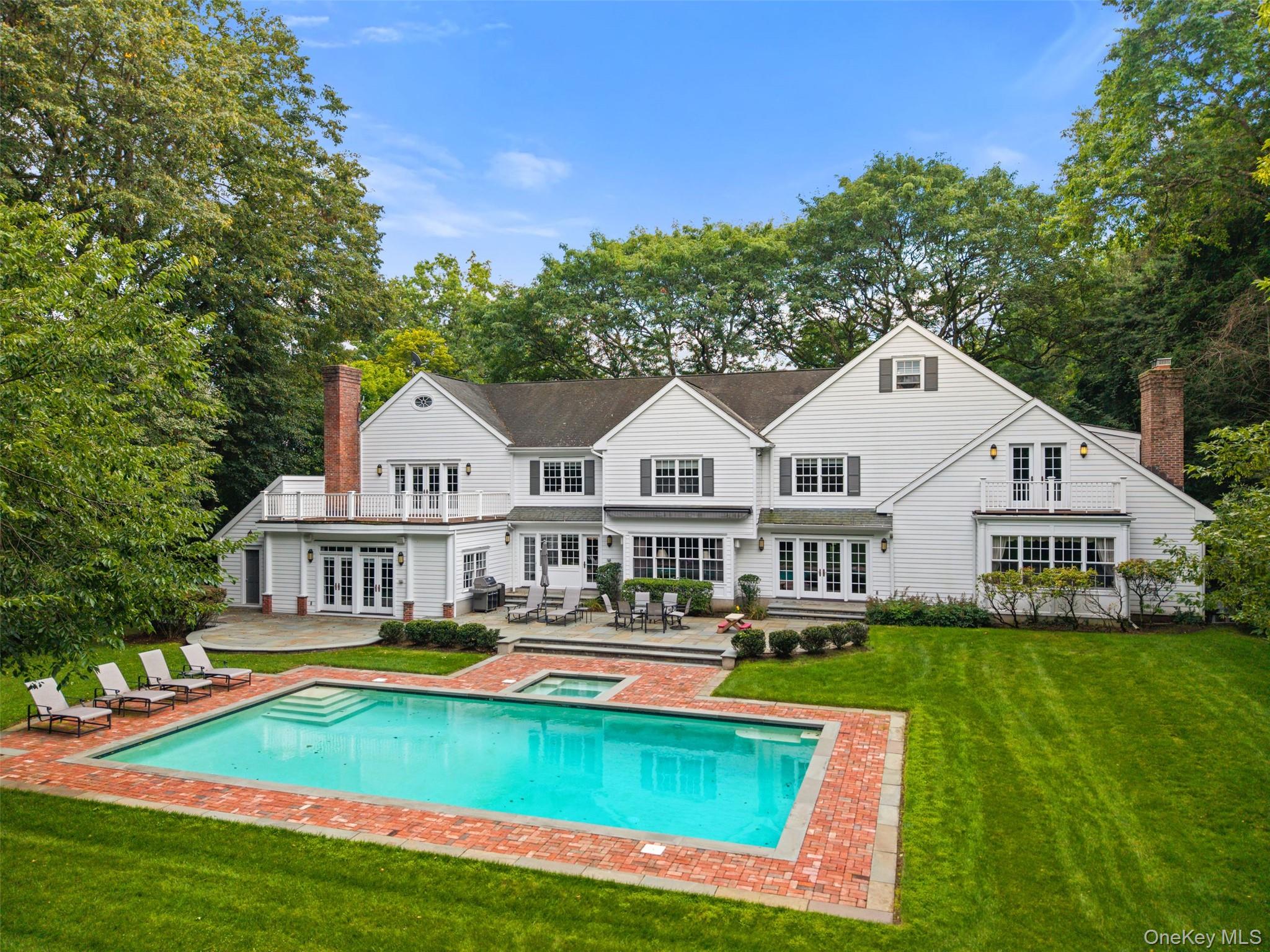 15 Sheldrake Road Scarsdale, NY 10583 - Photo 35 of 45 View of pool and patio with retractable awning
