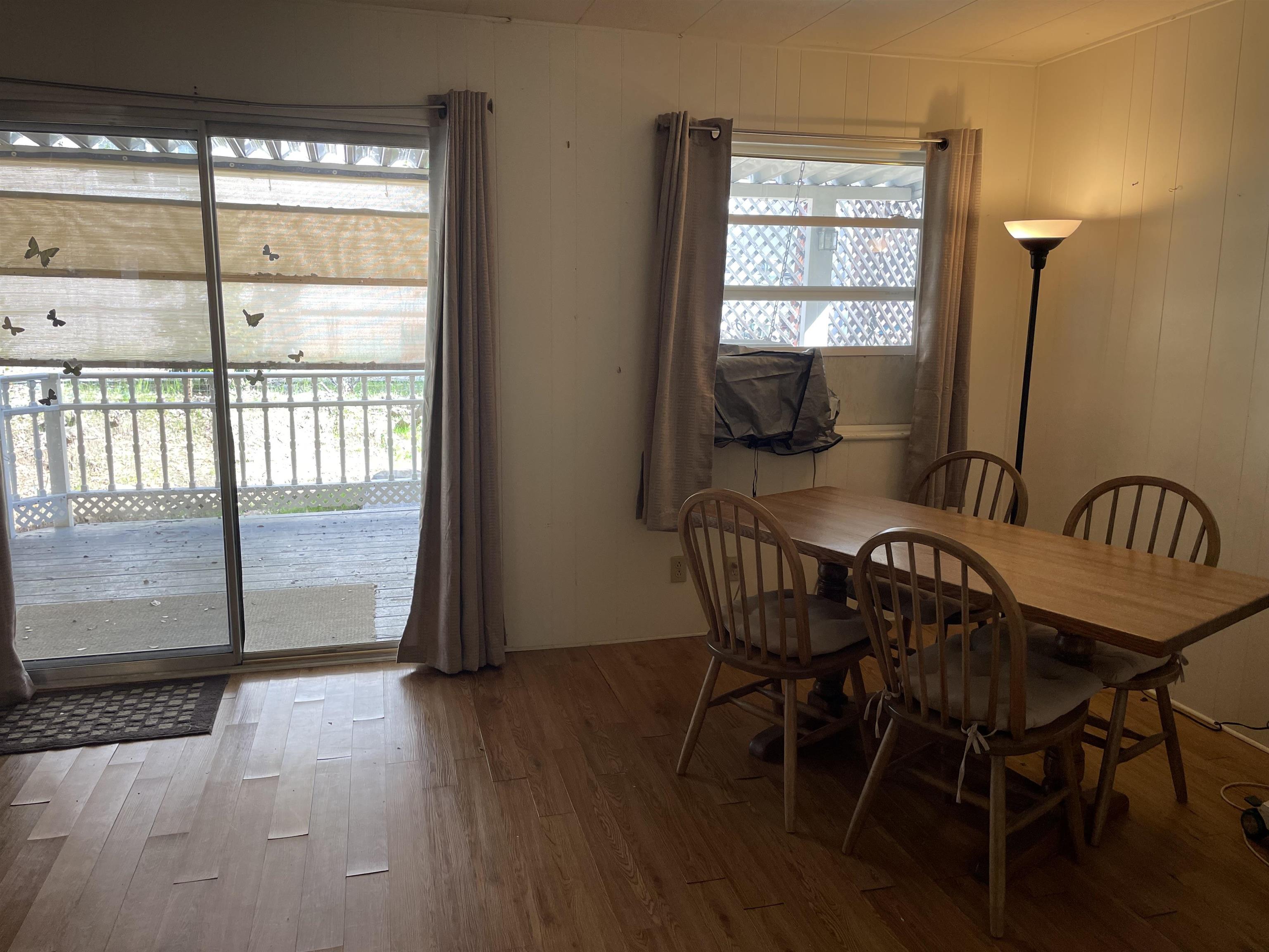 10956 Green Street, Unit 218 Columbia, CA 95310 - Photo 13 of 21 a view of a room with furniture window and wooden floor