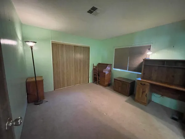 a view of livingroom with furniture and windows
