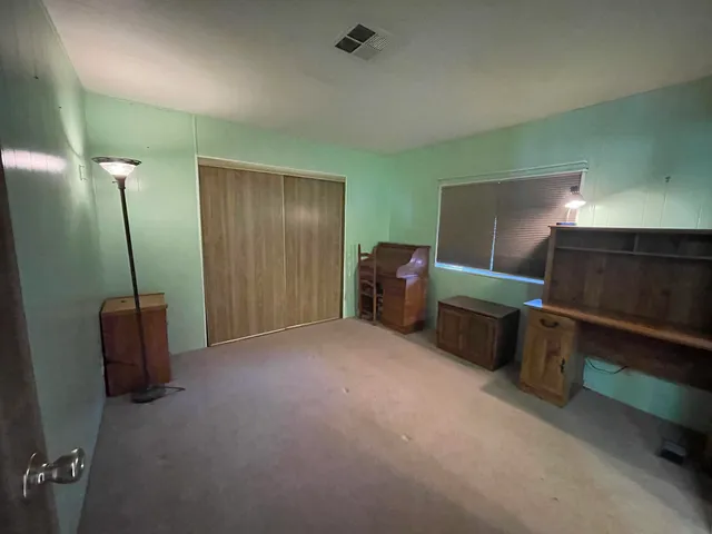 a view of livingroom with furniture and windows