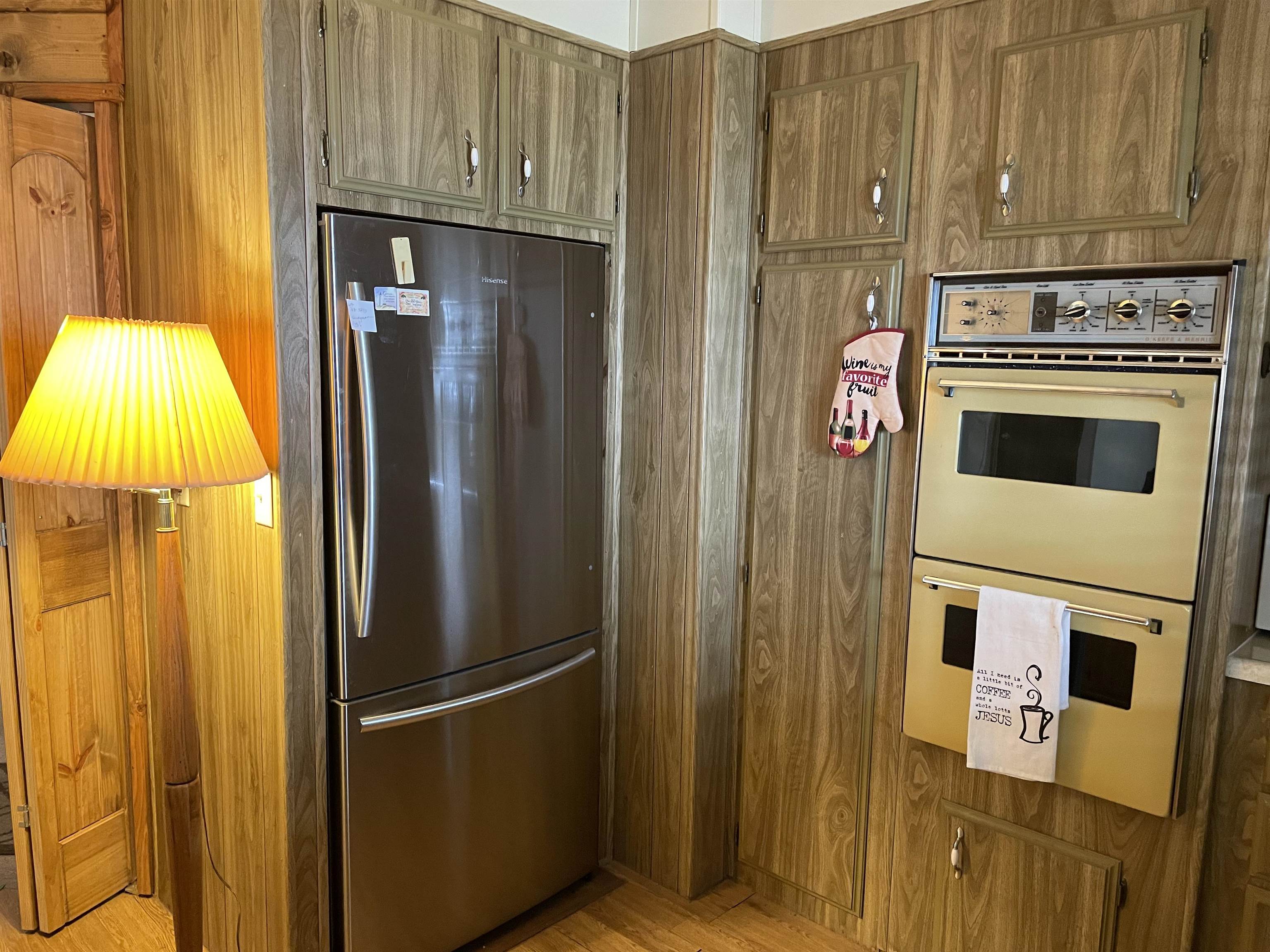 10956 Green Street, Unit 218 Columbia, CA 95310 - Photo 10 of 21 a kitchen with a refrigerator and stove