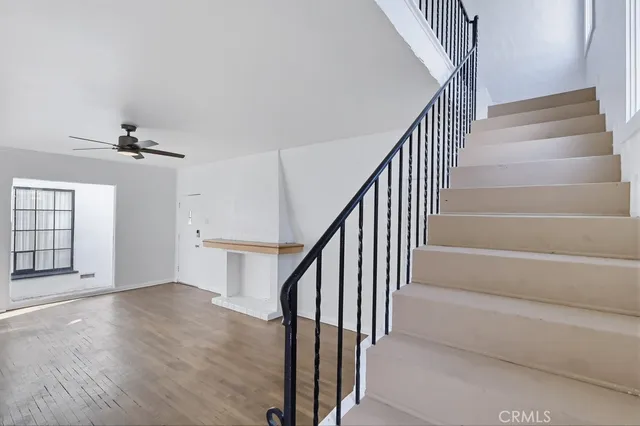 a view of an entryway with wooden floor