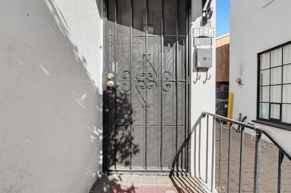 1527 East 3rd Street, Unit 1531 Long Beach, CA 90802 - Photo 37 of 38 a view of staircase with railing and white walls