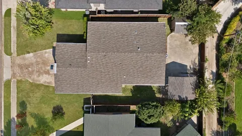 aerial view of a house with a yard