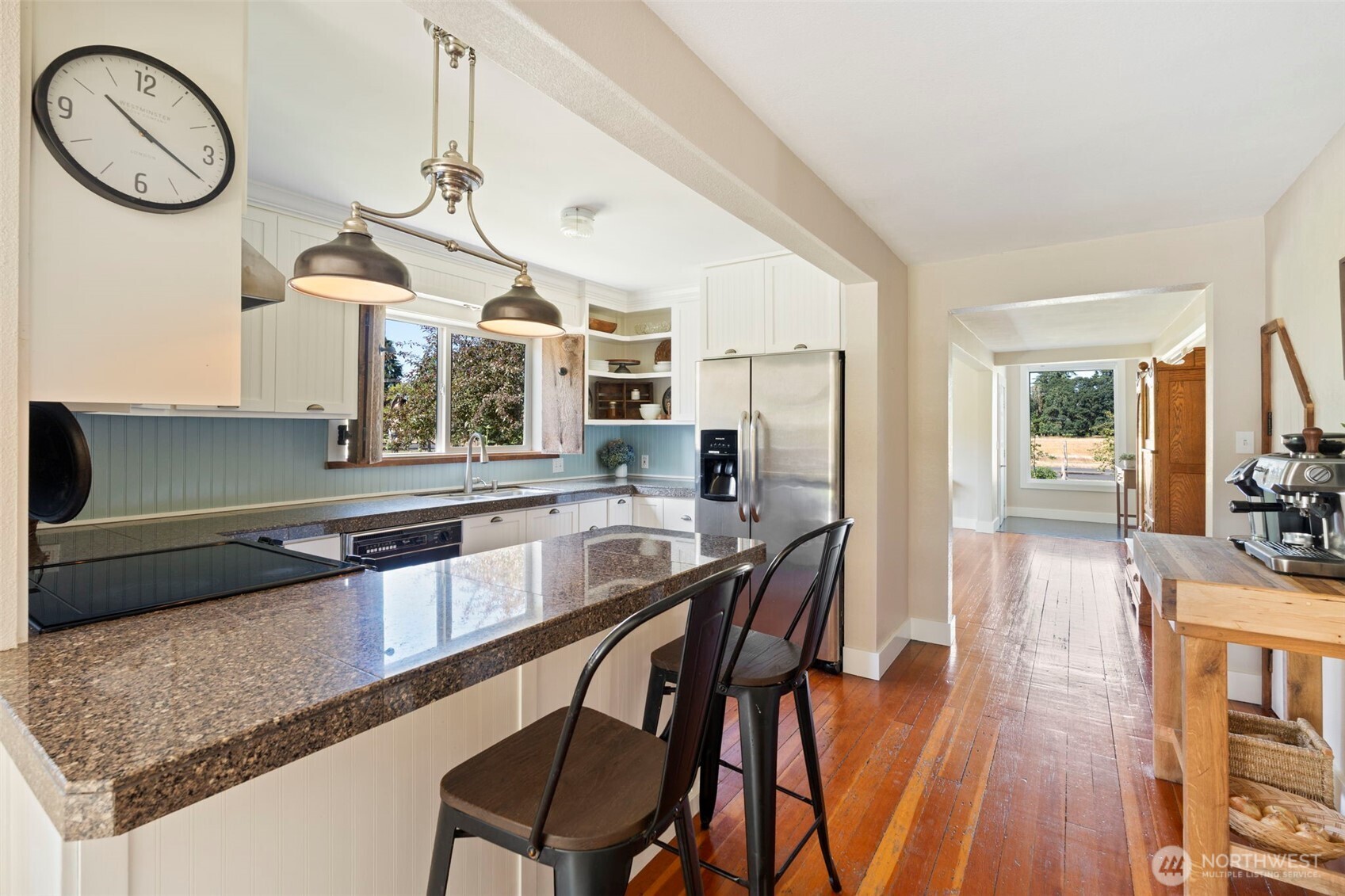 2118 Gallagher Road Centralia, WA 98531 - Photo 13 of 40 a kitchen with stainless steel appliances granite countertop a stove a sink a refrigerator and wooden floor