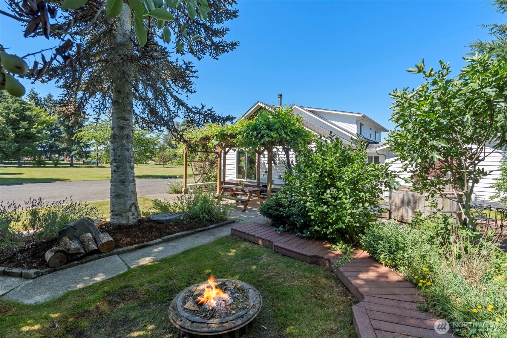 2118 Gallagher Road Centralia, WA 98531 - Photo 32 of 40 a view of a backyard with plants and a fountain