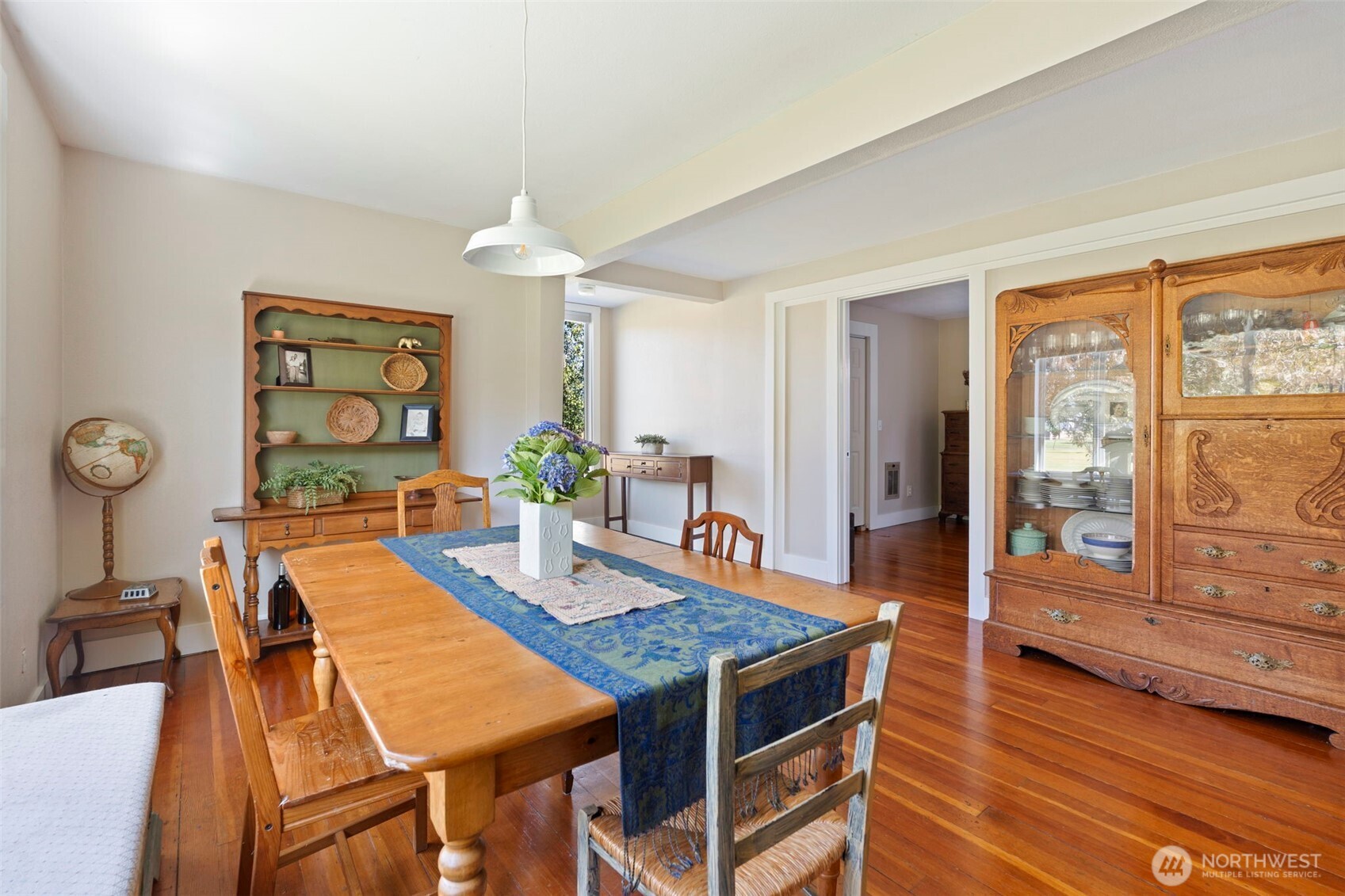 2118 Gallagher Road Centralia, WA 98531 - Photo 9 of 40 a dining room with wooden floor a chandelier a wooden table and chairs