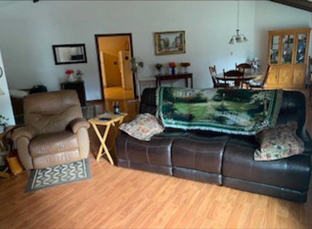 41077 Last Chance Lane Fall River Mills, CA 96028 - Photo 17 of 42 a living room with furniture and a wooden floor
