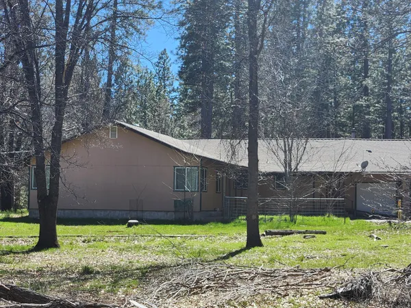 a view of a yard with swimming pool