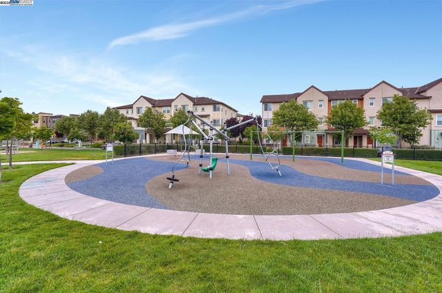 a swimming pool with outdoor seating and yard
