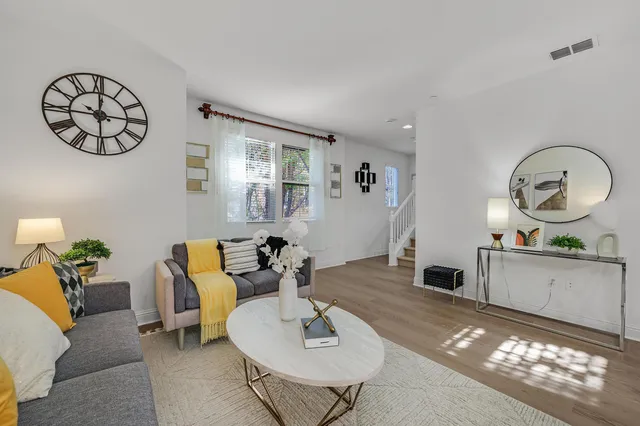 a kitchen with stainless steel appliances granite countertop sink stove and refrigerator