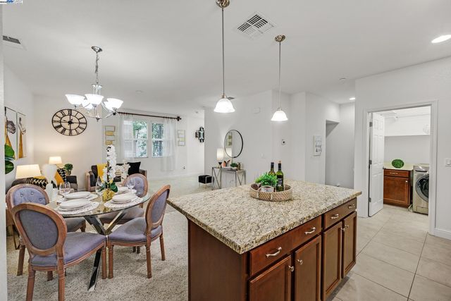 a kitchen with a table and chairs in it