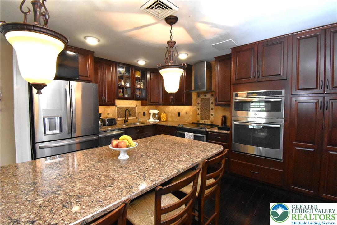 424 Grape Street Whitehall, PA 18052 - Photo 24 of 56 This chef's kitchen features stainless steel appliances and abundant cabinetry, perfect for culinary adventures.