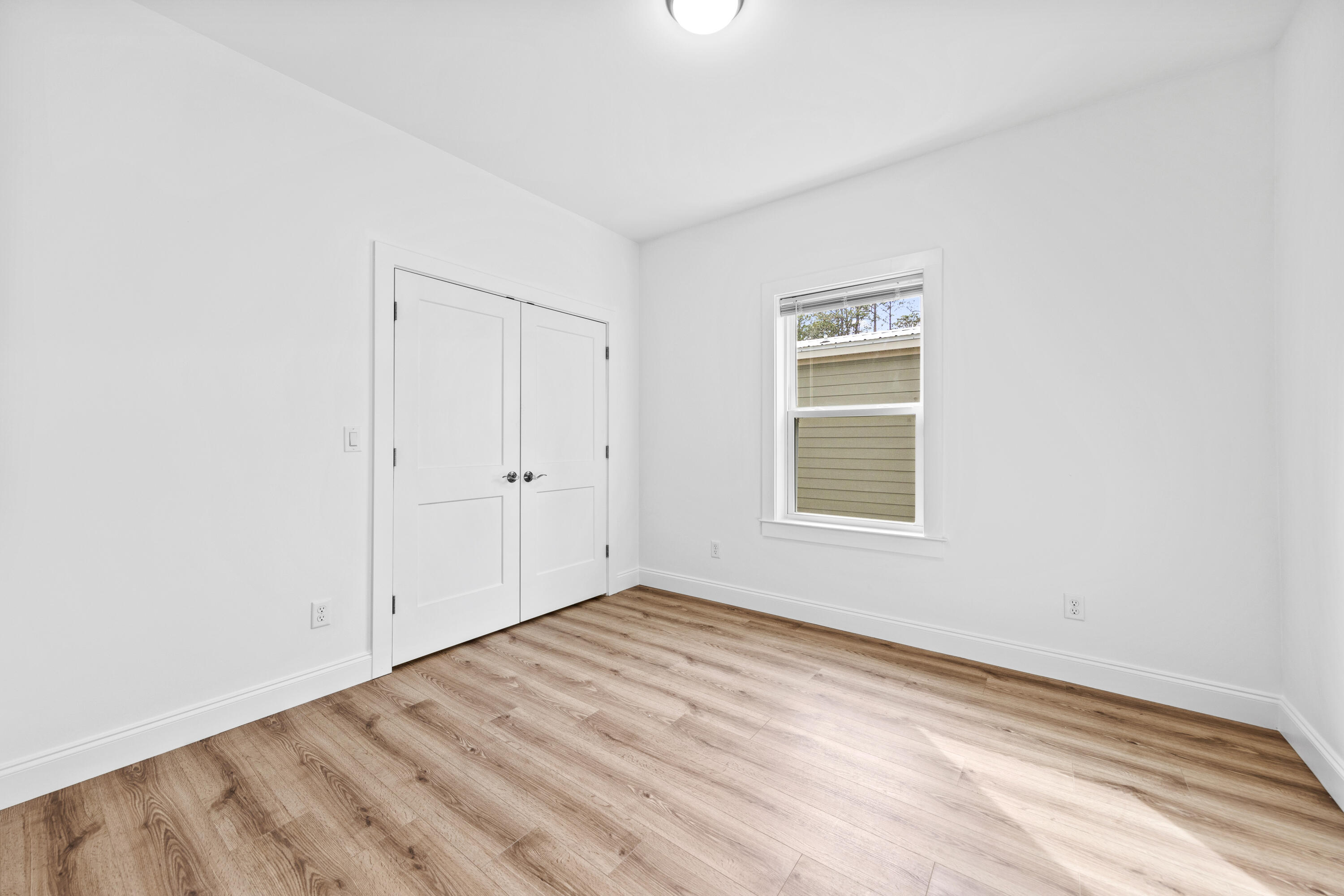 60 4th Street Santa Rosa Beach, FL 32459 - Photo 7 of 22 a view of empty room with wooden floor