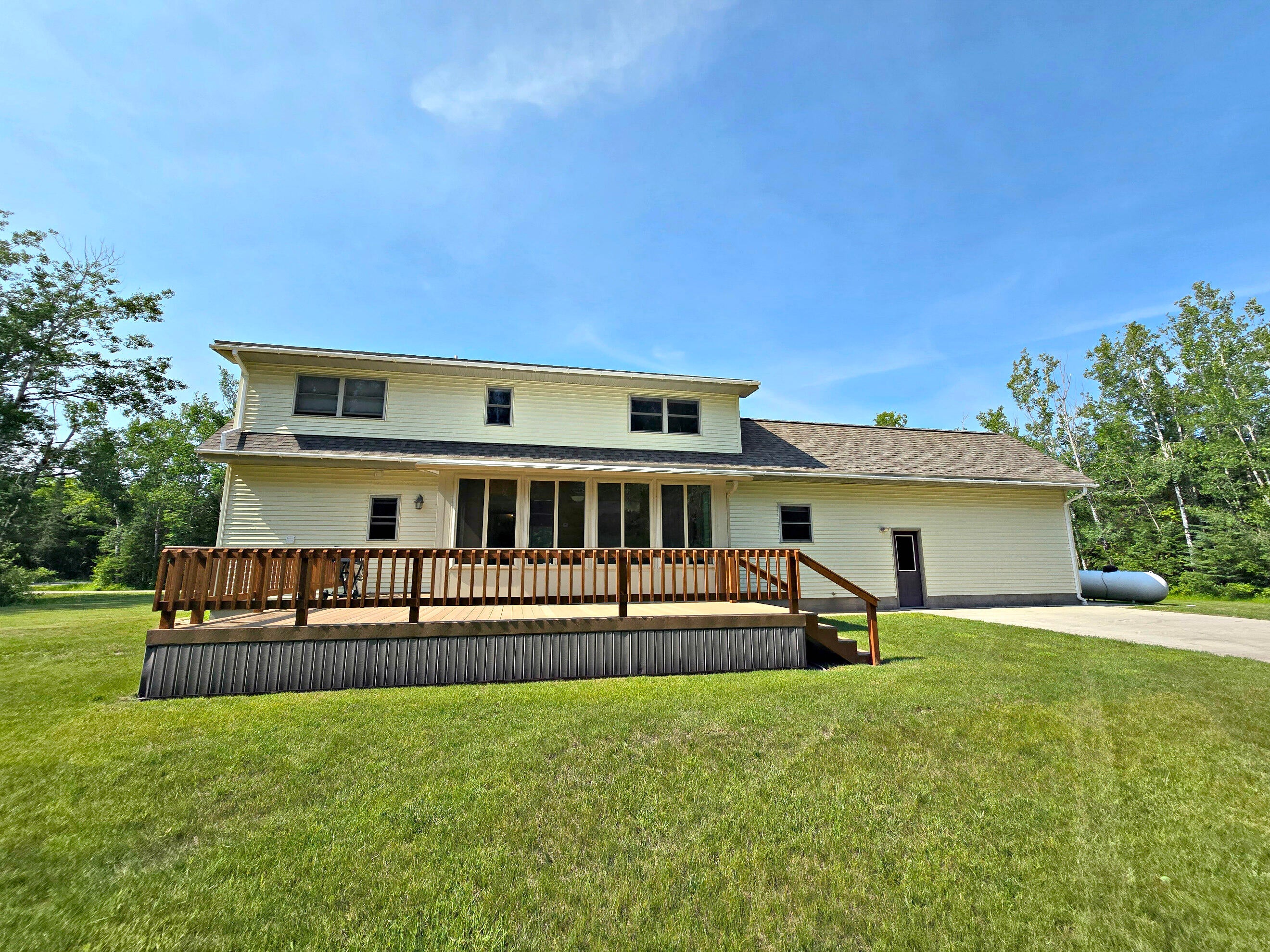 N705 Woods Road St. Ignace, MI 49781 - Photo 13 of 75 Sunroom on back of home