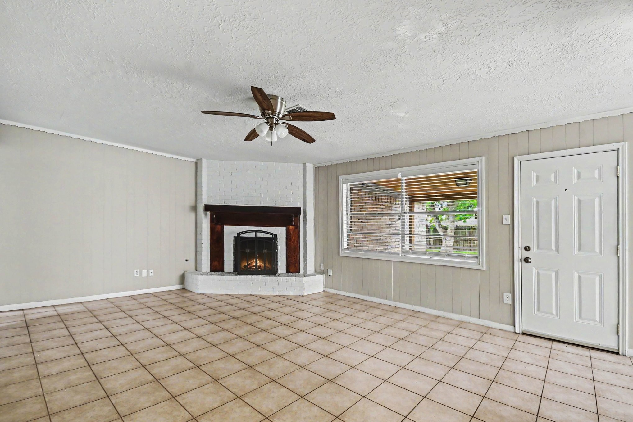 4306 Oneida Street Pasadena, TX 77504 - Photo 4 of 23 a view of an empty room with window and fireplace