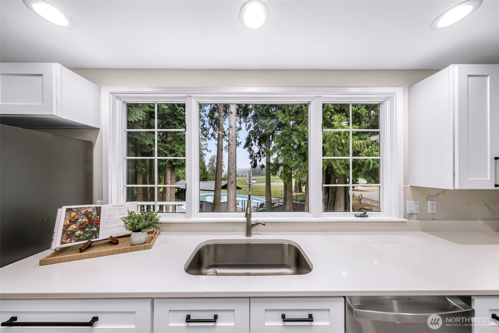9067 Sunrise Road Custer, WA 98240 - Photo 11 of 40 a kitchen with a sink and large window