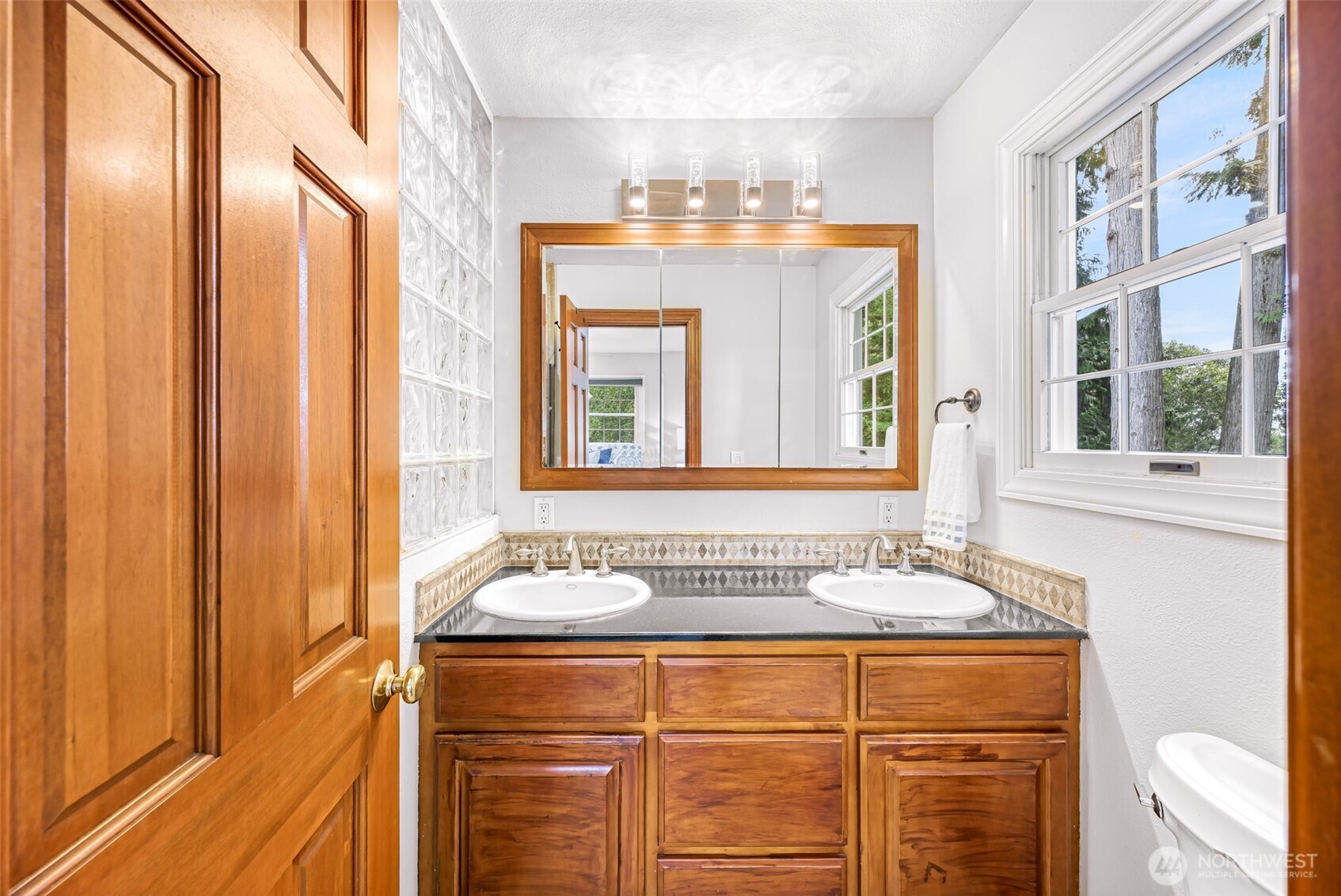 9067 Sunrise Road Custer, WA 98240 - Photo 15 of 40 a bathroom with a sink and a mirror