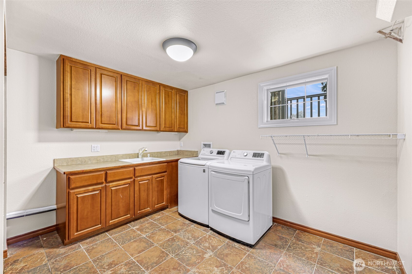 9067 Sunrise Road Custer, WA 98240 - Photo 21 of 40 a utility room with sink dryer and washer