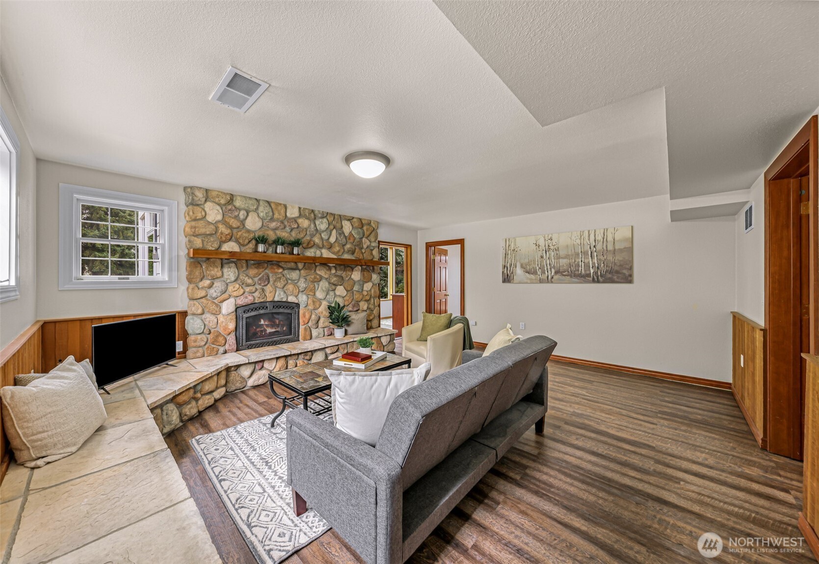 9067 Sunrise Road Custer, WA 98240 - Photo 23 of 40 a living room with furniture fireplace and flat screen tv