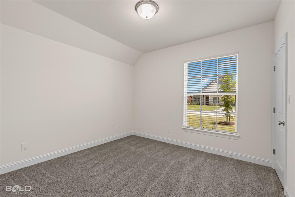 304 Prien Lk Loop Bossier City, LA 71111 - Photo 32 of 39 Room with neutral wall paint, gray patterned carpet, a single window with white blinds, and a flush mount ceiling light fixture