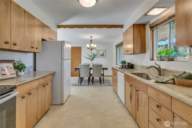 a kitchen with counter top space and cabinets