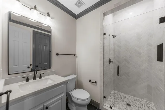 a view of a sink and dishwasher with wooden cabinet