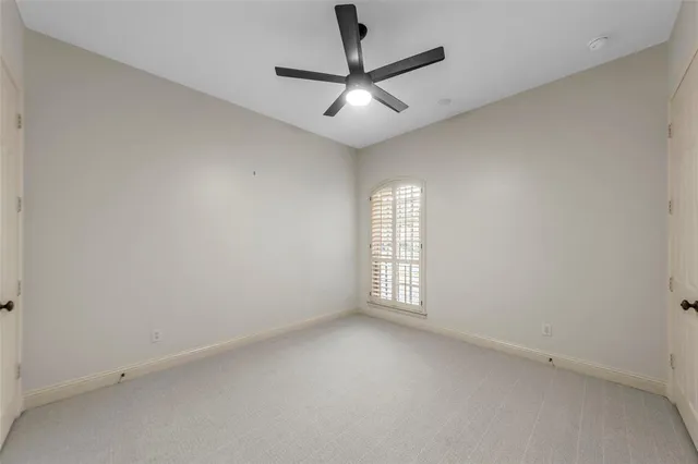 a large living room with kitchen island granite countertop furniture and a chandelier