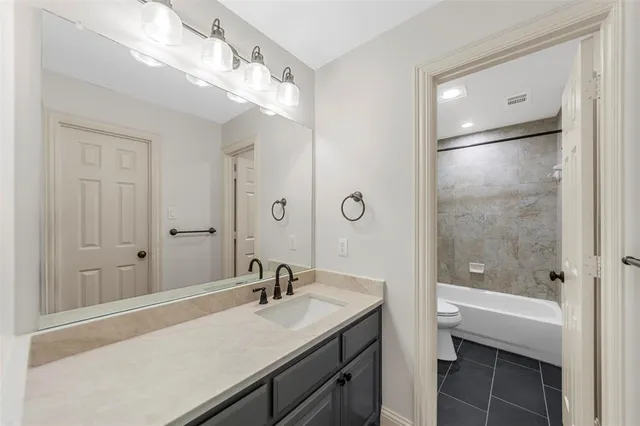 a spacious bathroom with a double vanity sink mirror and