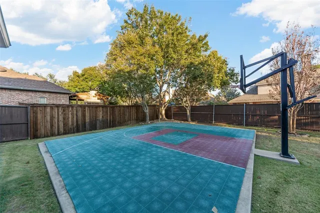 a view of a playground with basketball court