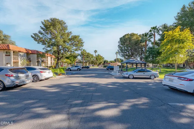 a swimming pool with outdoor seating and yard