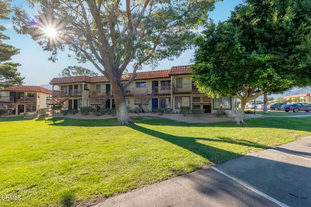 a house with swimming pool in front of it