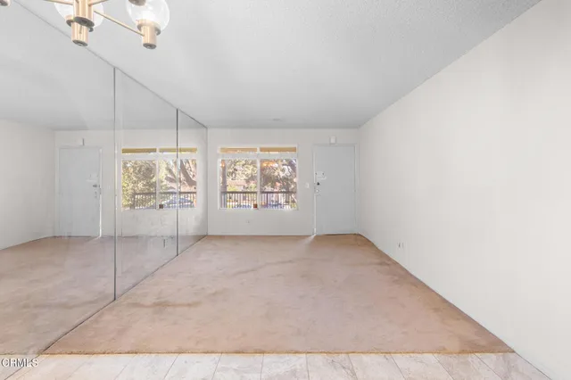 an empty room with windows