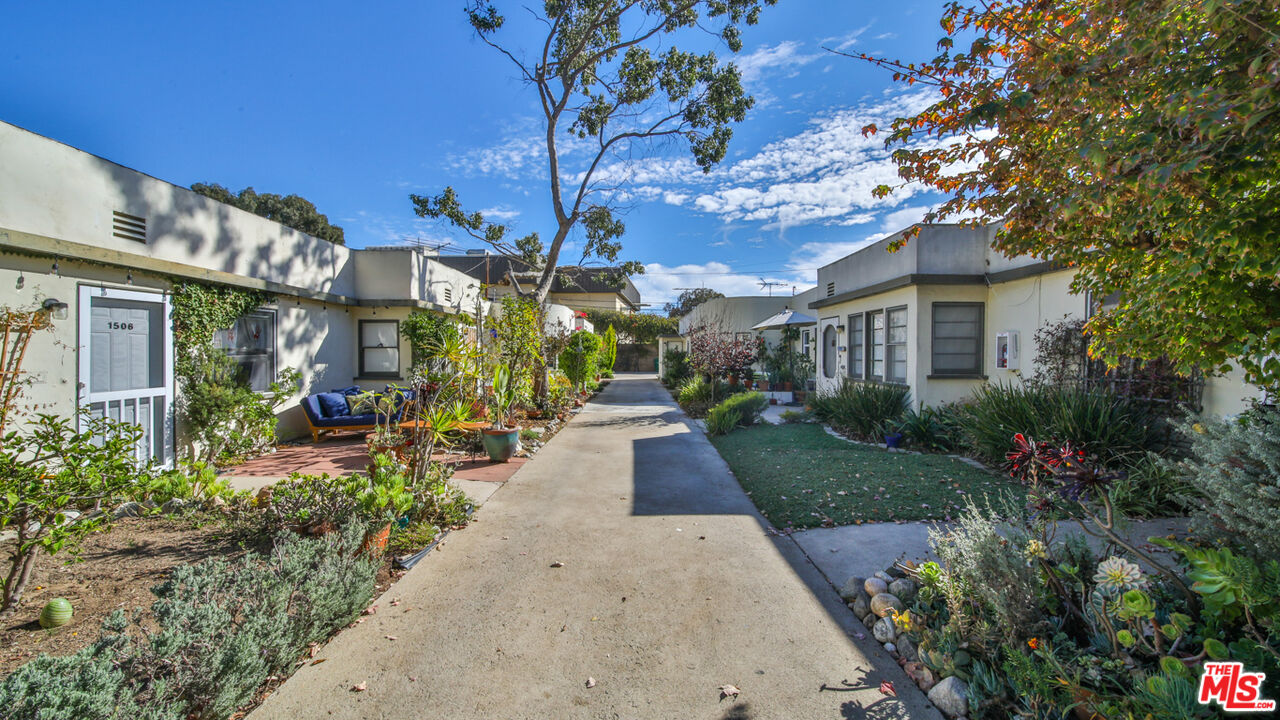 1502 Maple Street Santa Monica, CA 90405 - Photo 3 of 16 a view of a pathway with a house in the background